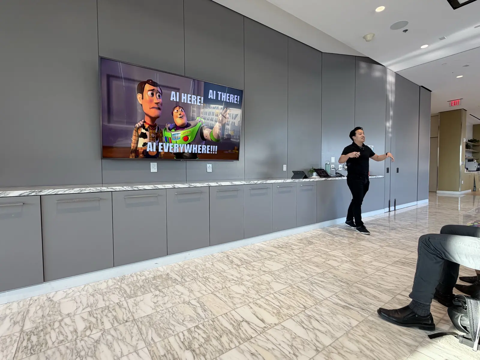 Ben Hong giving a talk in front of a presentation screen